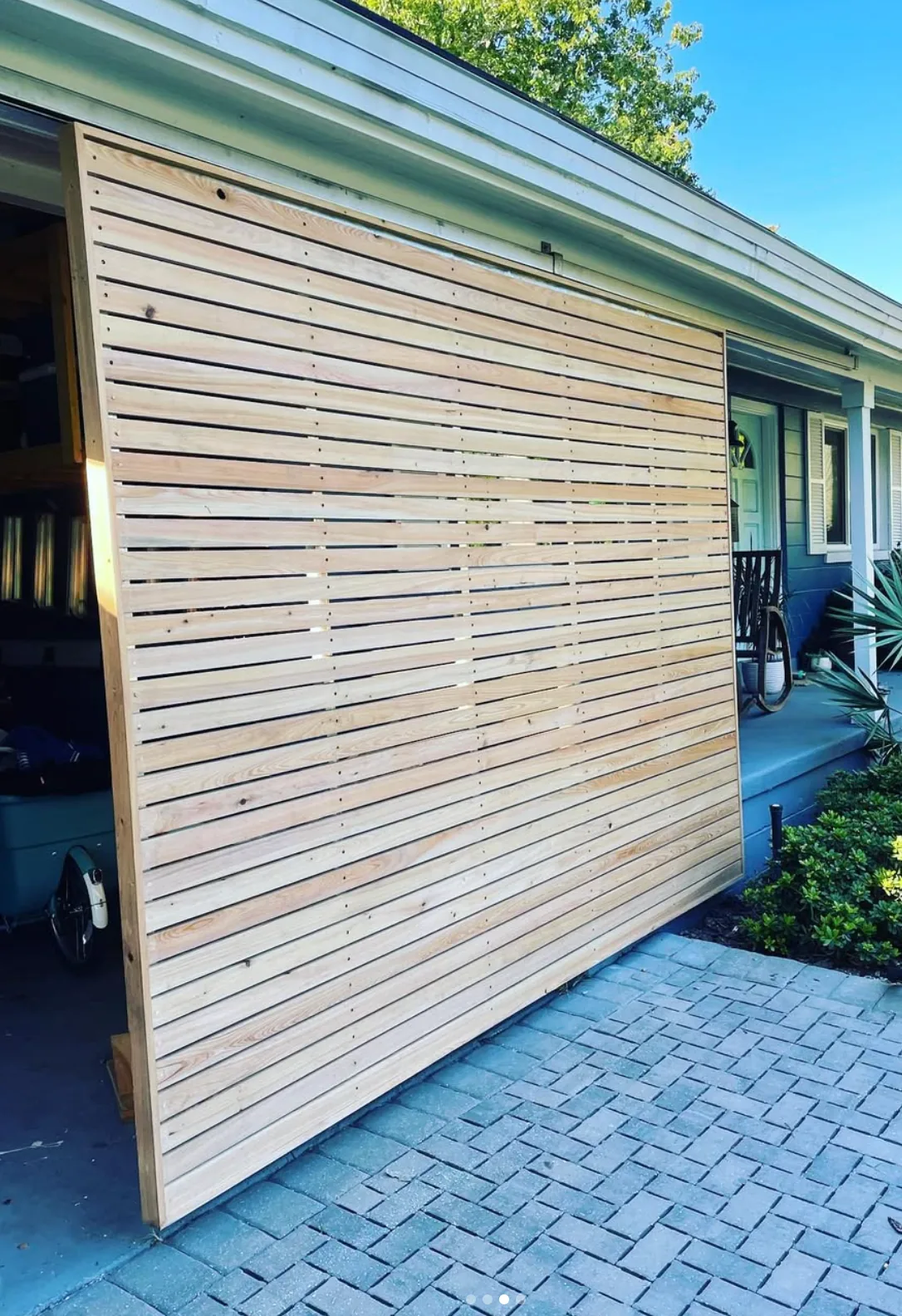 Custom wood sliding gate by Cypress Building Group